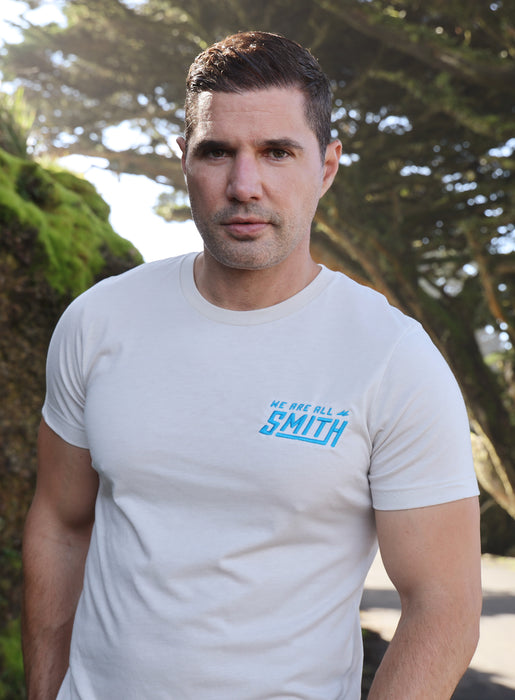 Heather Dust Blue WAAS logo Unisex t-shirt T-Shirts WE ARE ALL SMITH: Men's Jewelry & Clothing.   