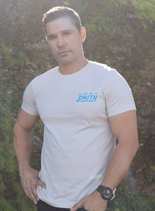Heather Dust Blue WAAS logo Unisex t-shirt T-Shirts WE ARE ALL SMITH: Men's Jewelry & Clothing.   