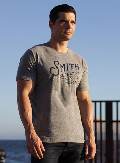 "Supply & Stock" Short sleeve t-shirt  WE ARE ALL SMITH   